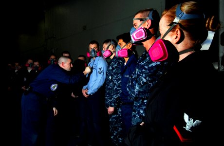 US Navy 091209-N-2475A-020 Logistics Specialist 2nd Class Dan Foster, from Hutchinson, Kan., performs respirator fit tests on Sailors in hangar bay one