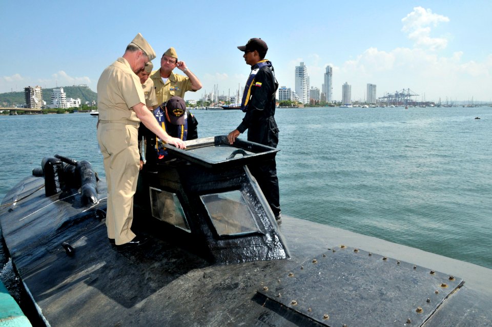 US Navy 091205-N-8273J-174 Chief of Naval Operations (CNO) Adm. Gary Roughead, left, tours a semi-submersible boat while meeting with Colombian Coast Guard Forces at Naval Base Bolivar