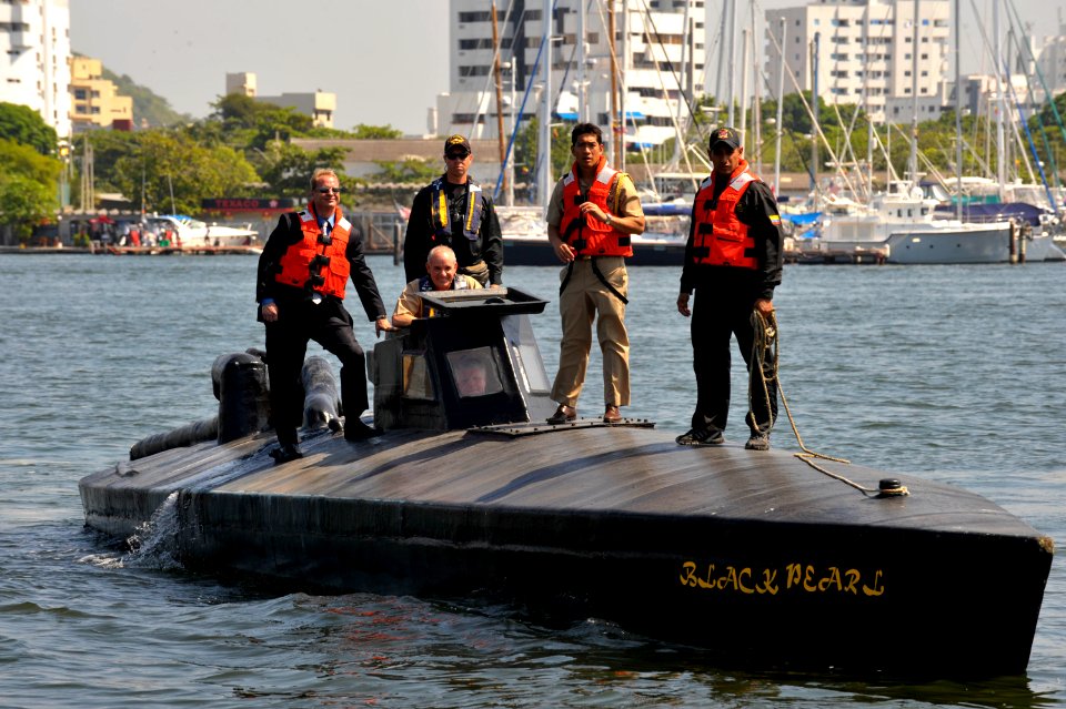 US Navy 091205-N-8273J-220 Chief of Naval Operations (CNO) Adm. Gary Roughead drives a semi-submersible boat while meeting with Colombian Coast Guard Forces at Naval Base Bolivar