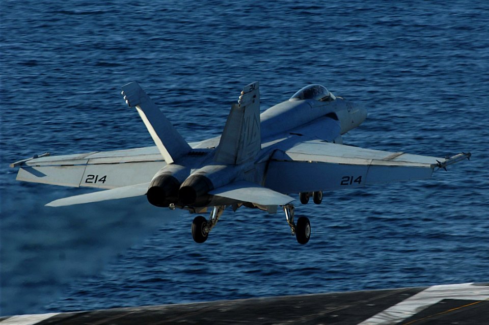 US Navy 091205-N-3038W-311 An F-A-18E Super Hornet assigned to the Tophatters of Strike Fighter Squadron (VFA) 14 launches from the aircraft carrier USS Nimitz (CVN 68)