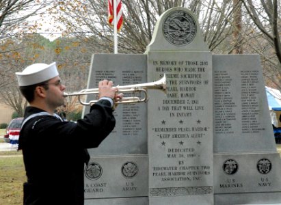 US Navy 091207-N-0000X-002 A bugler plays taps during a Pearl Harbor Remembrance Ceremony at Joint Expeditionary Base Little Creek-Fort Story photo
