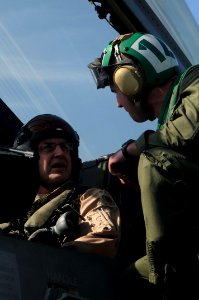 US Navy 091206-N-3038W-039 Lt. j.g. Kyle Terwilliger assigned to the Black Aces of Strike Fighter Squadron (VFA) 41 briefs Maj. Gen. Stephen L. Hoog, Deputy Combined Force Air Component Commander, U.S. Central Command, on the F
