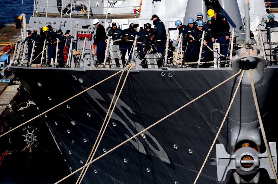 US Navy 091207-N-7280V-117 ailors aboard the Arleigh Burke-class guided-missile destroyer USS John S. McCain (DDG 56) take in lines before getting underway