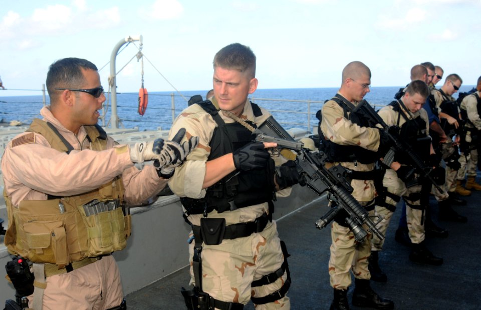 US Navy 091209-N-1291E-050 Members of the visit, board, search and seizure team of the guided-missile cruiser USS Chosin (CG 65) practice transition drills from their primary to secondary weapons