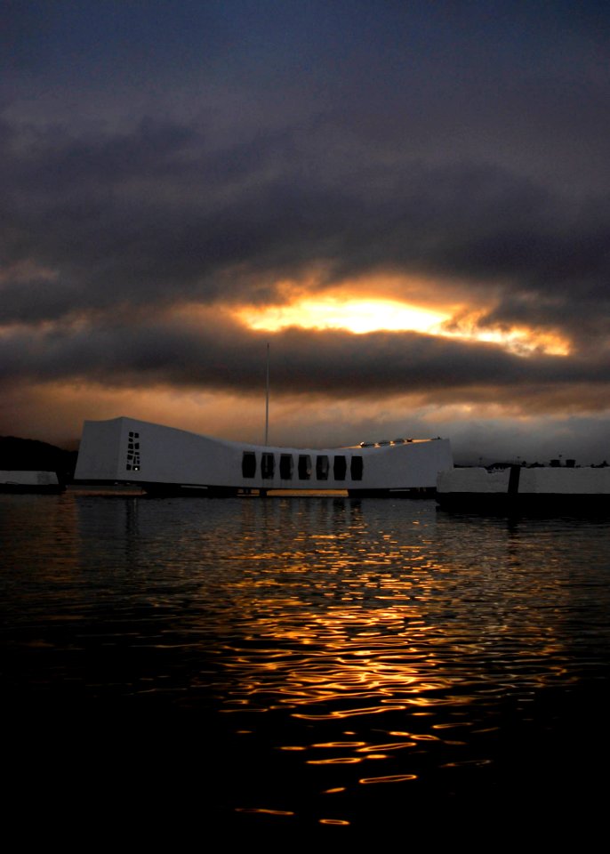 US Navy 091207-N-8539M-363 The sun rises over the USS Arizona Memorial on the 68th anniversary of the attack on Pearl Harbor