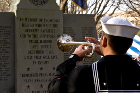 US Navy 091207-N-7874H-146 A bugler plays taps during a Pearl Harbor remembrance ceremony at Joint Expeditionary Base Little Creek-Fort Story