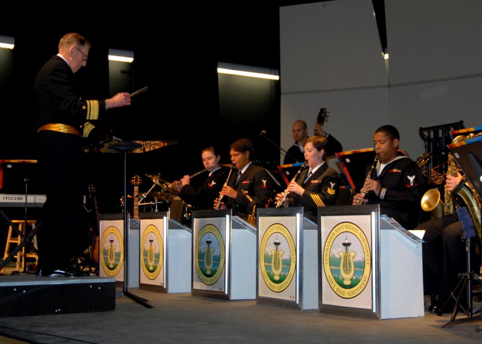 US Navy 091212-N-9860Y-004 Retired Rear Adm. George Lotzenhiser, from Coupeville, Wash., conducts the Navy Band Northwest in a performance of