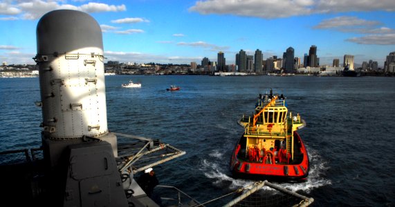 US Navy 091208-N-2475A-014 A tug boat pulls alongside USS John C. Stennis (CVN 74)
