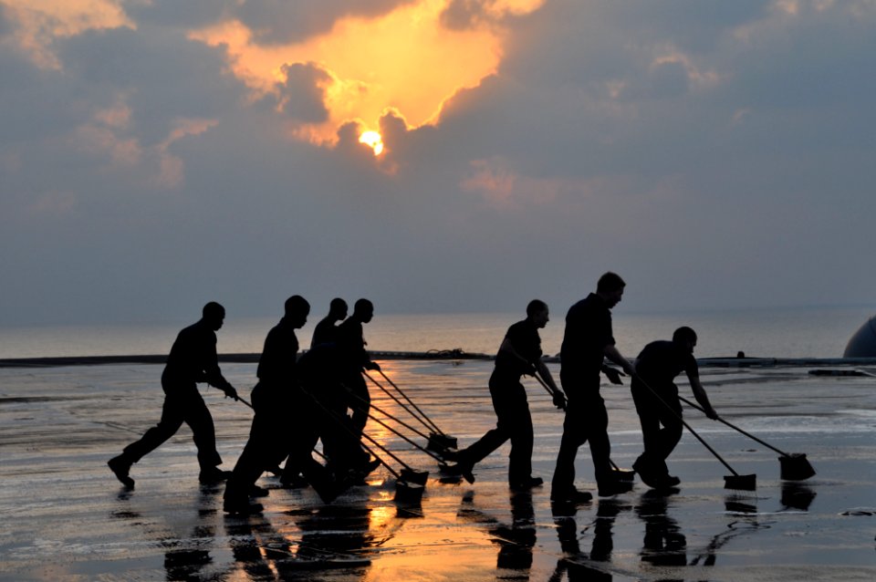 US Navy 091211-N-8421M-056 Sailors wash down the flight deck of the aircraft carrier USS Nimitz (CVN 68)