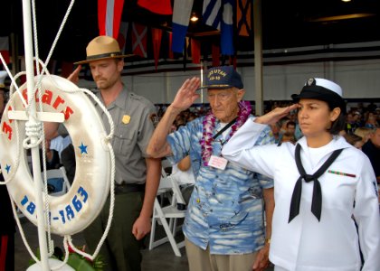 US Navy 091207-N-5476H-080 A survivor of the Dec. 7, 1941 surprise attack on Pearl Harbor hangs a wreath during a U.S. Navy and National Park Service ceremony commemorating the 68th anniversary of the Dec. 7, 1941 surprise atta photo