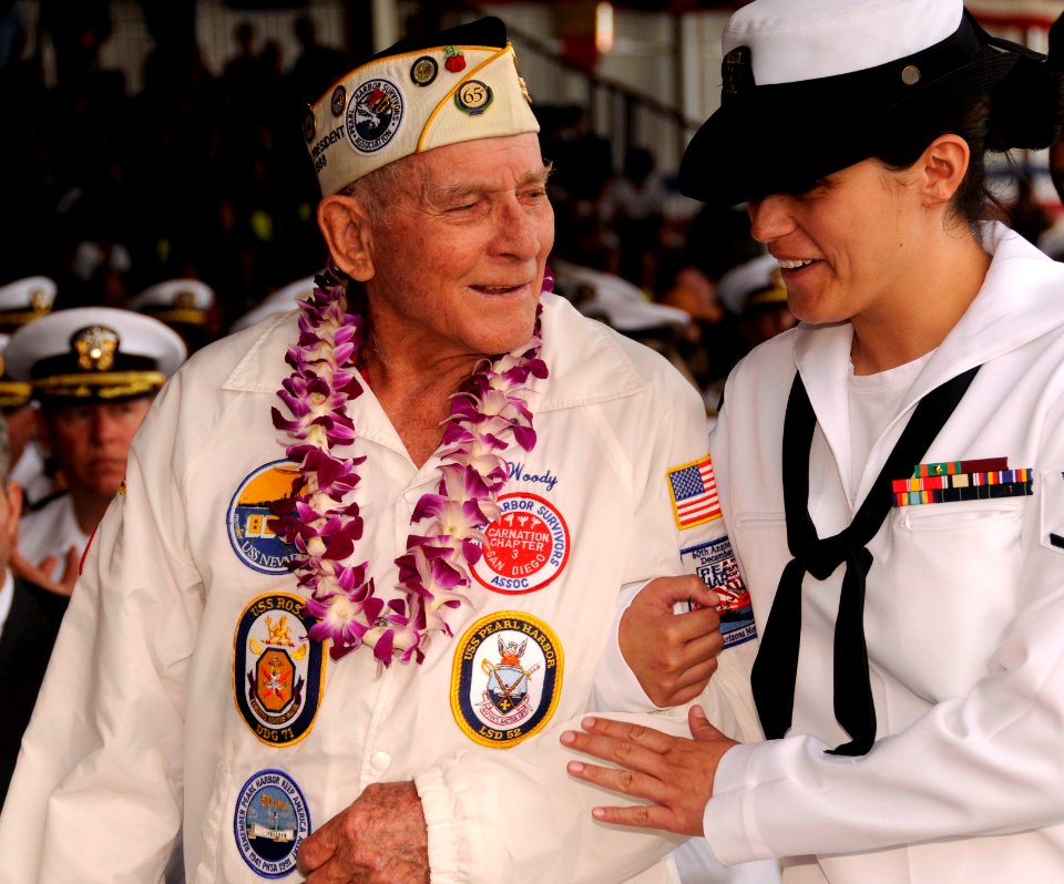 US Navy 091207-N-7498L-470 Personnel Specialist 3rd Class Kathleen McDowell escorts Pearl Harbor attack survivor Woody Derby during a U.S. Navy and National Park Service ceremony