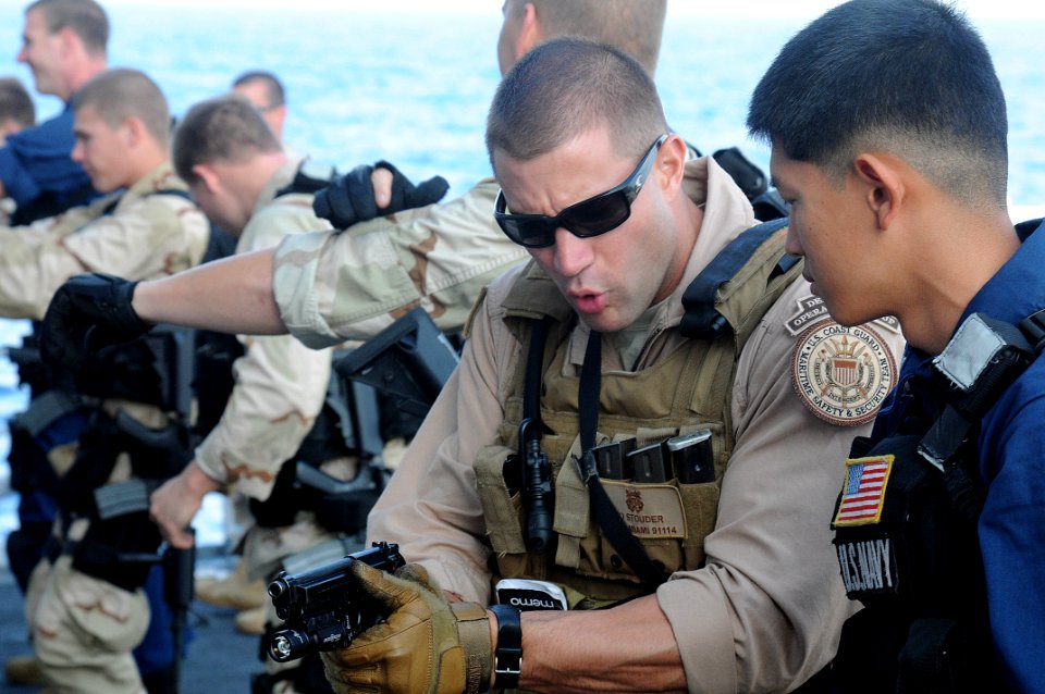 US Navy 091218-N-1291E-001 The visit, board, search and seizure team assigned to the guided-missile cruiser USS Chosin (CG 65) practice weapons handling and dry firing with both their primary and secondary weapons