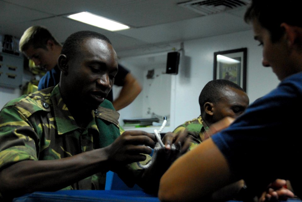 US Navy 091208-N-9999X-795 Sailors assigned to Mobile Diving and Salvage Unit (MDSU) 2 teach Tanzanian Peoples Defense Force Navy sailors proper knot tying
