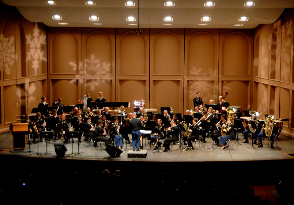 US Navy 091218-N-4649C-001 Snowflakes light the stage as Navy Band Northwest and the 56th Army Band perform at Bremerton High School