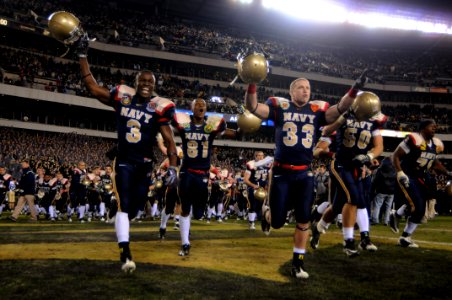 US Navy 091212-N-5319A-586 U.S. Navy Midshipmen celebrate their victory over the U.S. Military Academy after the 110th Army-Navy college football game at Lincoln Financial Field in Philadelphia