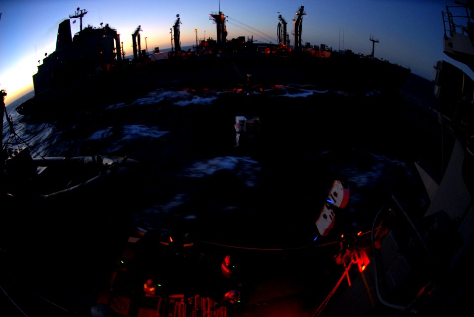 US Navy 091212-N-2600H-006 Sailors aboard guided-missile cruiser USS Chosin (CG 65) receive stores from the Fleet Replenishment Oiler USNS Kanawha (T-AO 196) during a replenishment at sea in the Somali Basin