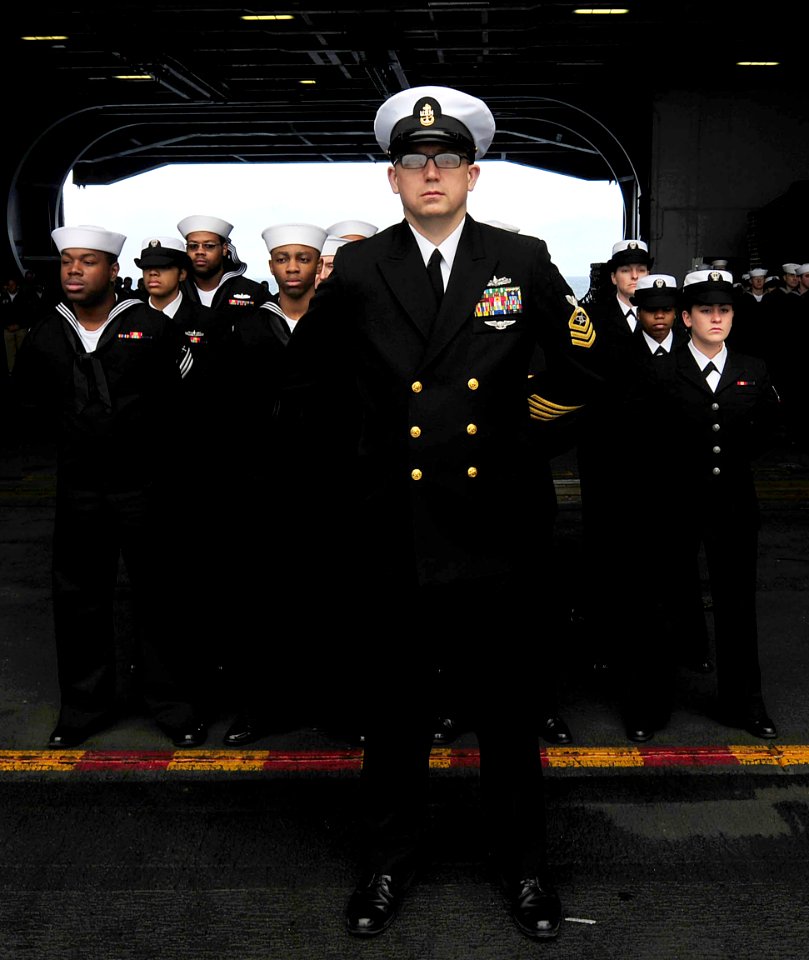 US Navy 091213-N-9928E-031 Sailors stand in formation during a burial at sea ceremony aboard USS John C. Stennis (CVN 74)