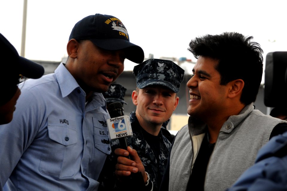 US Navy 091221-N-3610L-136 Aviation Boatswain's Mate (Handling) 2nd Class Keith Hayes speaks about his holiday plans during a live interview with Ruben Galvan