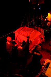US Navy 091212-N-0260R-266 Sailors move stores from pallets transferred from USNS Kanawha (T-AO 196)