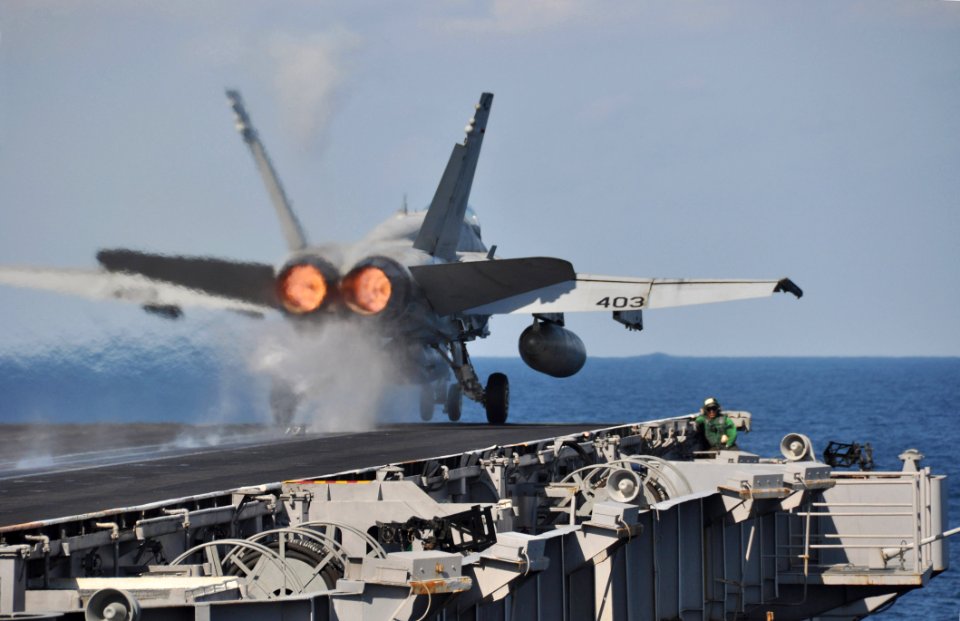 US Navy 091215-N-8421M-008 An F-A-18C Hornet assigned to the Sidewinders of Strike Fighter Squadron (VFA) 86 launches from the aircraft carrier USS Nimitz (CVN 68)