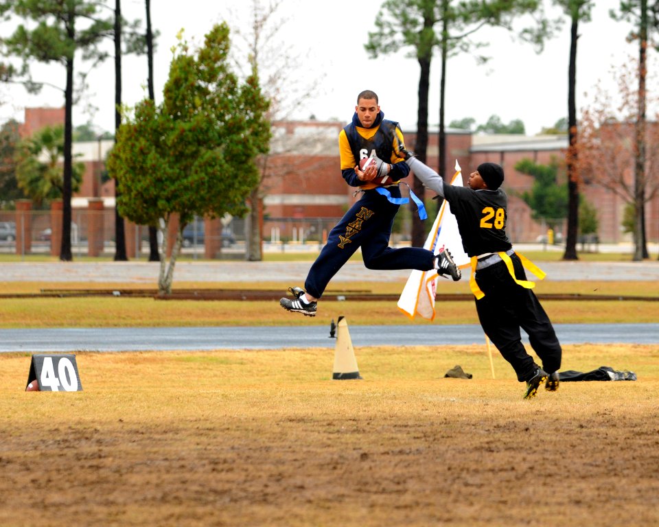 US Navy 091212-N-5328N-307 ryptologic Technician (Technical) Seaman Recruit Jesse Wilson intercepts a football during the seventh annual Flag Football game between Army and Navy