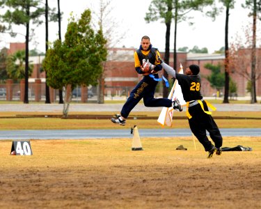 US Navy 091212-N-5328N-307 ryptologic Technician (Technical) Seaman Recruit Jesse Wilson intercepts a football during the seventh annual Flag Football game between Army and Navy