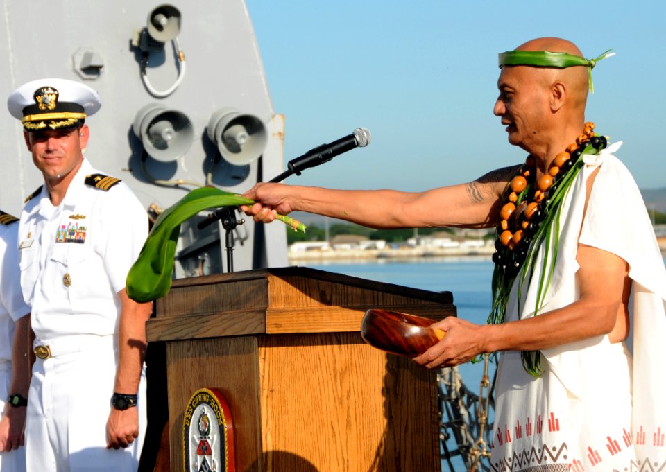US Navy 091214-N-3666S-035 Kahu Ray Ganotise performs a traditional Hawaiian blessing while Cmdr. Michael McCartney looks on