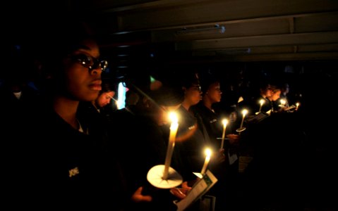 US Navy 091217-N-9928E-180 Sailors participate in a candlelight Christmas service on the forecastle aboard USS John C. Stennis (CVN 74)