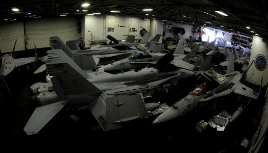 US Navy 100105-N-4236E-028 Aircraft handlers fit aircraft from Carrier Air Wing 7 in the hangar bay of the Nimitz-class aircraft carrier USS Dwight D. Eisenhower (CVN 69)