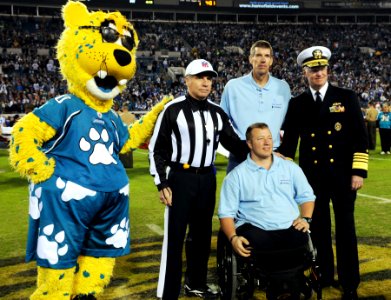 US Navy 091217-N-1522S-003 Chief of Naval Operations (CNO) Adm. Gary Roughead and Ride 2 Recovery Participant Nathan Hunt, pose for a photo