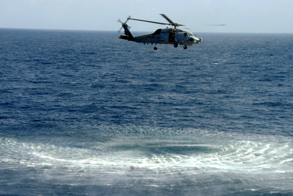 US Navy 100105-N-2600H-086 An SH-60B Sea Hawk helicopter hovers above a life jacket in the Gulf of Aden