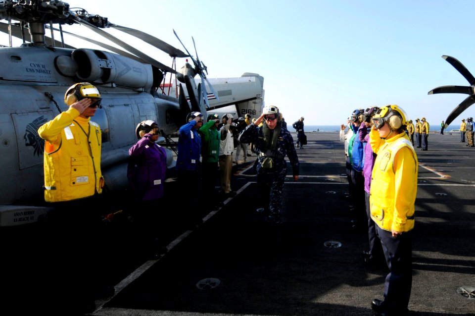US Navy 100106-N-3038W-023 Rainbow side boys render honors to Chief of Naval Operations (CNO) Adm. Gary Roughead aboard the aircraft carrier USS Nimitz (CVN 68)