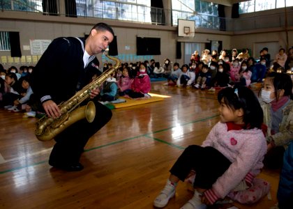 US Navy 091221-N-8721D-045 Musician 1st Class Chris Sams performs during a concert by the 7th Fleet Brass Band at Ogusu Elementary School