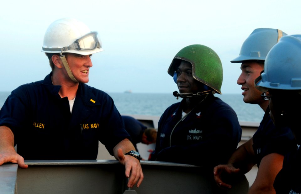 US Navy 091226-N-1291E-108 Members of the deck department of the guided-missile cruiser USS Chosin (CG 65) speak aboard the ship as they depart Djibouti