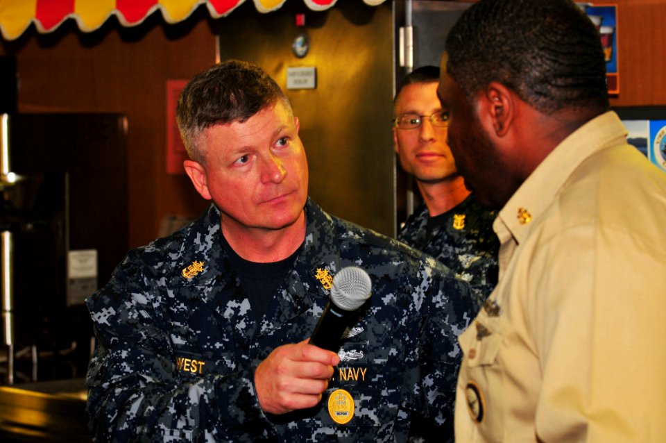 US Navy 100106-N-4053P-053 Master Chief Petty Officer of the Navy (MCPON) Rick West speaks with Chief Navy Career Counselor Jeffery Ingram
