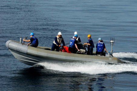 US Navy 091221-N-3038W-192 Sailors assigned to the aircraft carrier USS Nimitz (CVN 68) conduct operations in a rigid hull inflatable boat