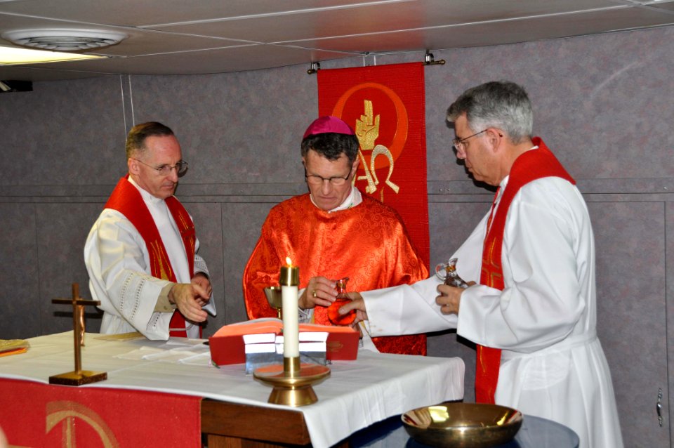 US Navy 091226-N-8421M-070 The Most Rev. Timothy Broglio, Fr. James Danner and Fr. Frank Foley celebrate Catholic Mass aboard USS Nimitz (CVN 68)