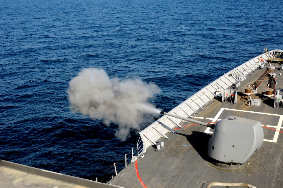 US Navy 091227-N-1291E-051 The 5-inch-54-caliber (Mk 45) lightweight gun of the guided-missile cruiser USS Chosin (CG 65) is fired during a training exercise
