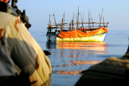US Navy 100101-N-1291E-165 Members of a visit, board, search and seizure team and a U.S. Coast Guard maritime safety and security team from the guided-missile cruiser USS Chosin (CG 65) approach a dhow