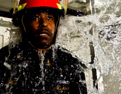 US Navy 100105-N-7498L-093 Chief Damage Controlman Gregory Hightower teaches how to perform damage control procedures while inside a flooded compartment
