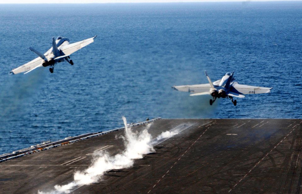 US Navy 100105-N-3038W-074 Two F-A-18F Super Hornet strike fighters, assigned to the Black Aces of Strike Fighter Squadron (VFA) 41, launch from the aircraft carrier USS Nimitz (CVN 68)