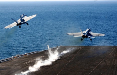 US Navy 100105-N-3038W-074 Two F-A-18F Super Hornet strike fighters, assigned to the Black Aces of Strike Fighter Squadron (VFA) 41, launch from the aircraft carrier USS Nimitz (CVN 68)