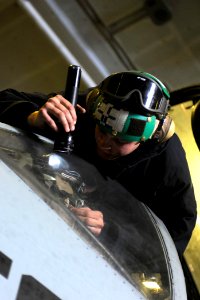 US Navy 100104-N-6604E-154 Aviation Electrician's Mate Airman Matthew Gould performs a maintenance check on an E-A-6B Prowler