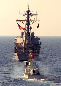 US Navy 100110-N-3925A-001 The guided-missile destroyer USS Benfold (DDG 65) and the Royal Bahraini fast attack craft Al Jabiri (PGGF 21) are underway in the U.S. 5th Fleet area of responsibility