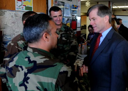 US Navy 100111-N-9095H-064 aster Chief Navy Diver Ross Garcia speaks with Virginia Governor-Elect Bob McDonnell at the USO of Hampton Roads at Joint Expeditionary Base Little Creek-Fort Story