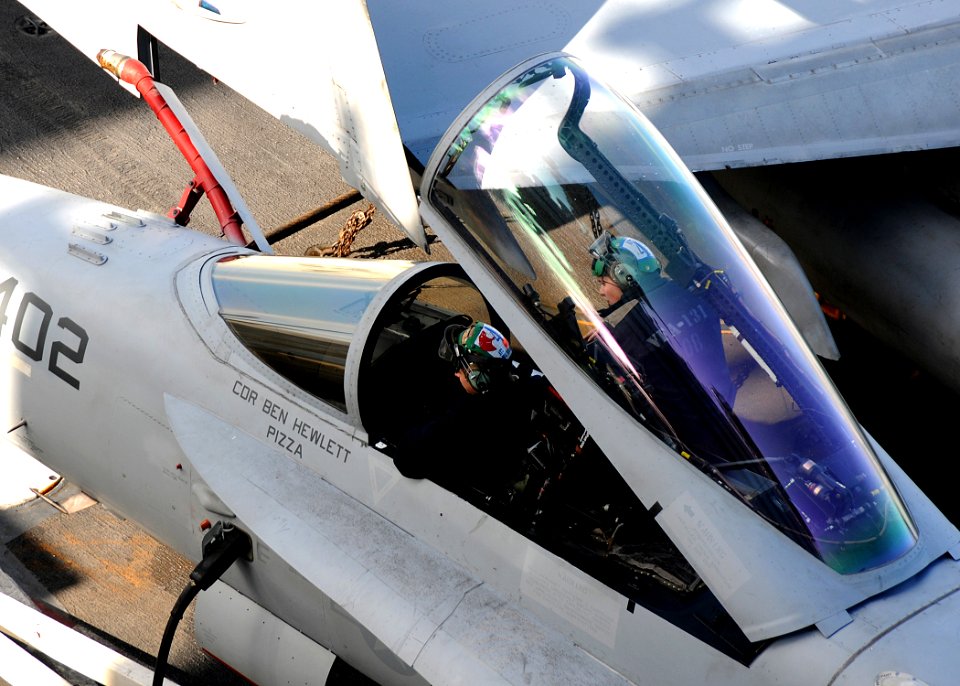 US Navy 100106-N-4236E-121 Aviation electronics technicians work on an F-A-18 Hornet