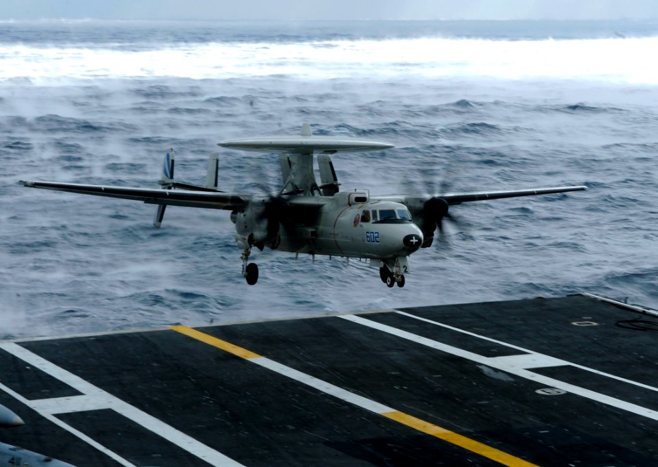 US Navy 100103-N-6604E-160 An E-2C Hawkeye assigned to the Bluetails of Airborne Warning Squadron (VAW) 121 lands during flight operations aboard the aircraft carrier USS Dwight D. Eisenhower (CVN 69)