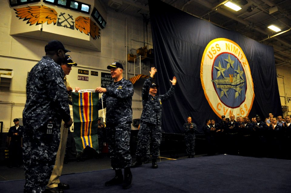 US Navy 100106-N-8273J-376 Chief of Naval Operations (CNO) Adm. Gary Roughead presents the Meritorious Unit Commendation to Capt. Paul Monger