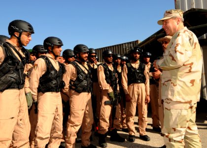 US Navy 100110-N-0803S-001 Rear Adm. Thomas Cropper congratulates United Arab Emirates soldiers on their completion of a U.S. Coast Guard visit, board, search and seizure course