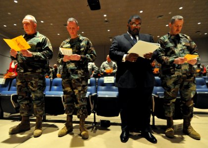 US Navy 100112-N-7367K-001 Seabees follow along in their programs during a ceremony honoring the Rev. Dr. Martin Luther King, Jr